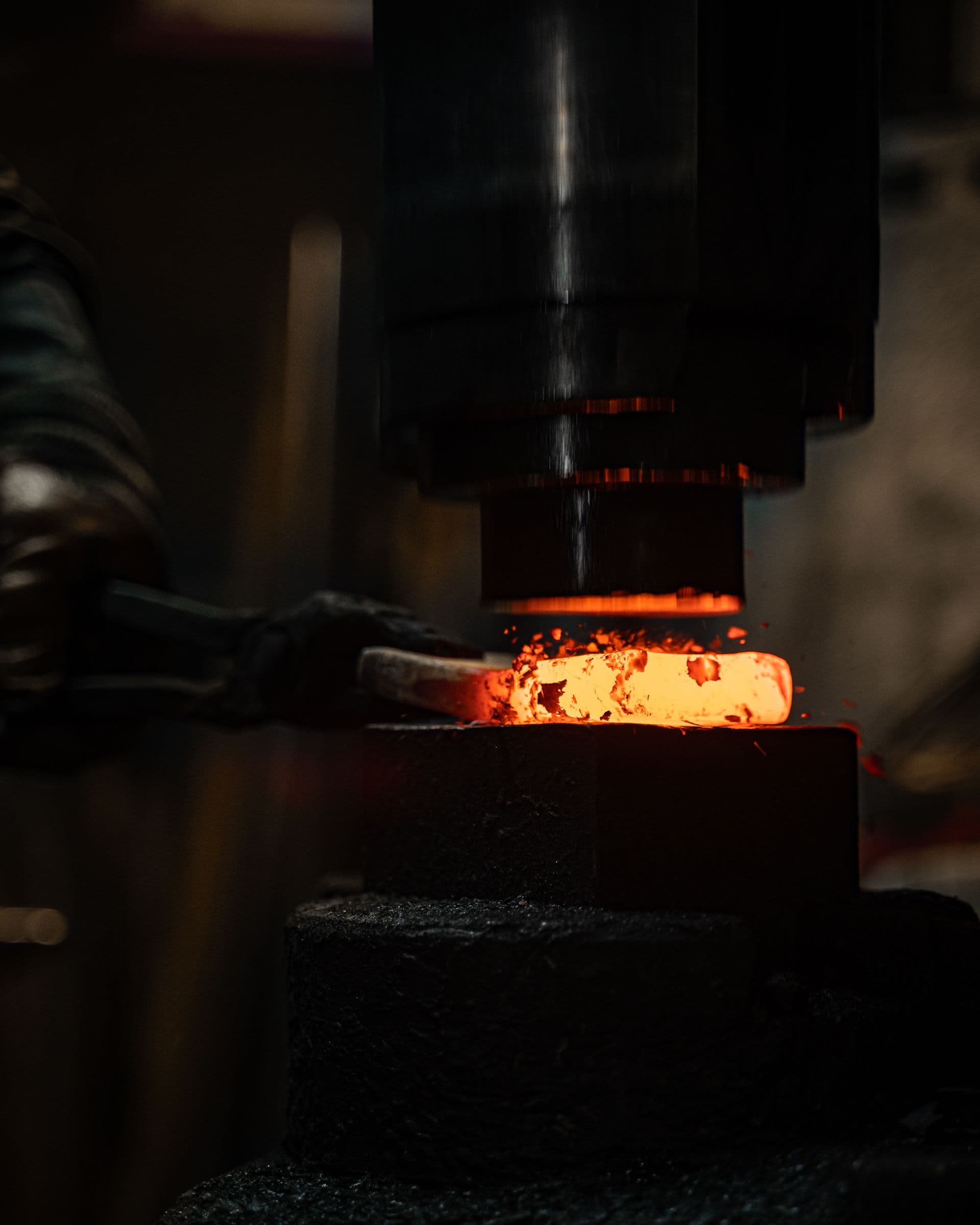 Hot metal component being formed in a forging press